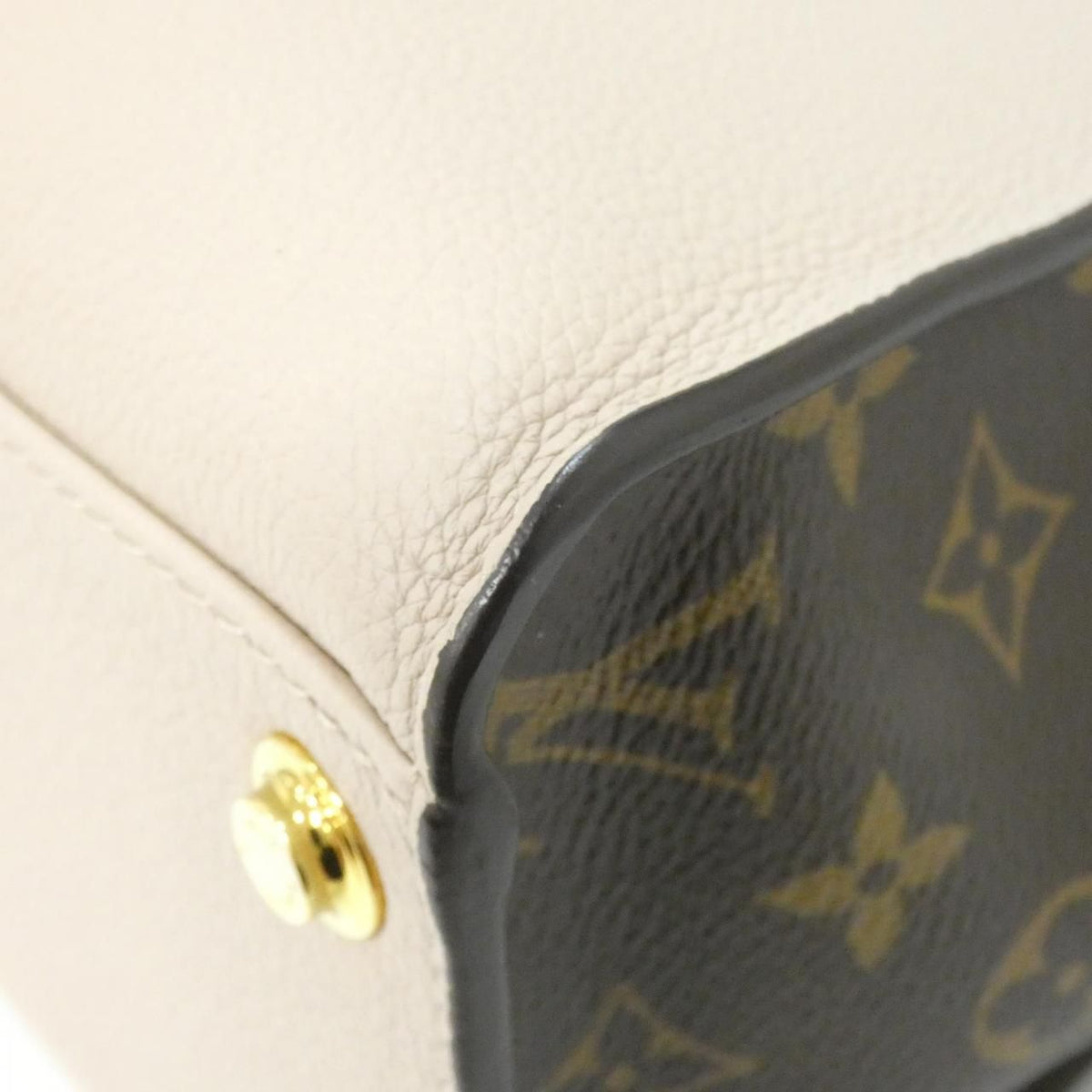 Louis Vuitton On My Side calf leather coated canvas bag