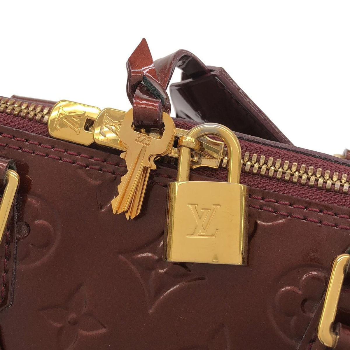 Louis Vuitton Alma Vernis Handbag